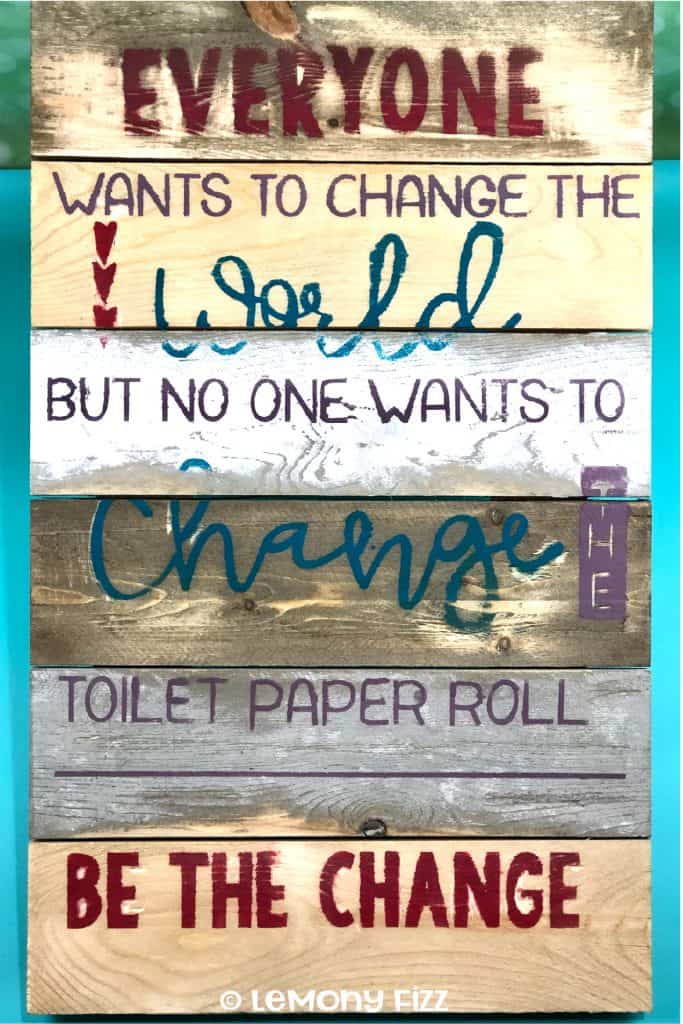 A wooden sign with a bathroom quote for home decor.