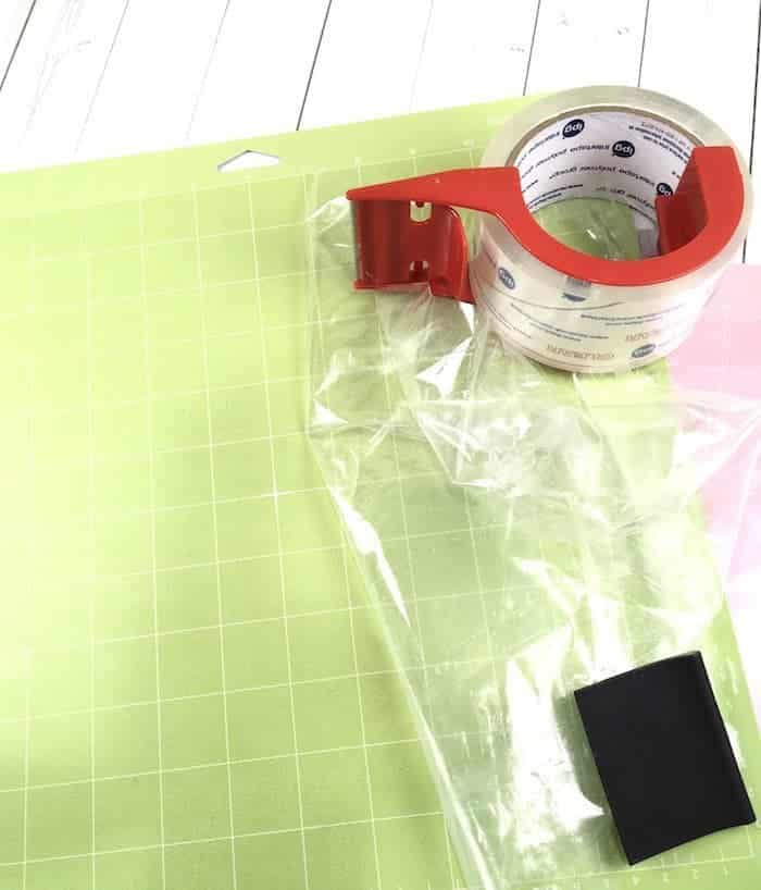 Use packing tape or transfer tape to clean your Cricut cutting mat.