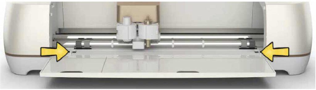 The brackets that you load a Cricut cutting mat under when you use a Cricut Maker.