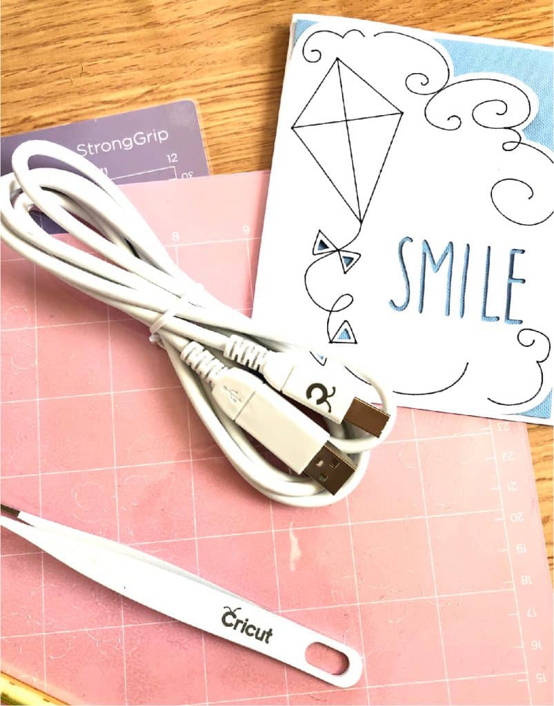 Sample project and cords that come with a Cricut Maker