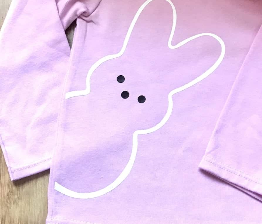 white heat transfer vinyl on a pink shirt