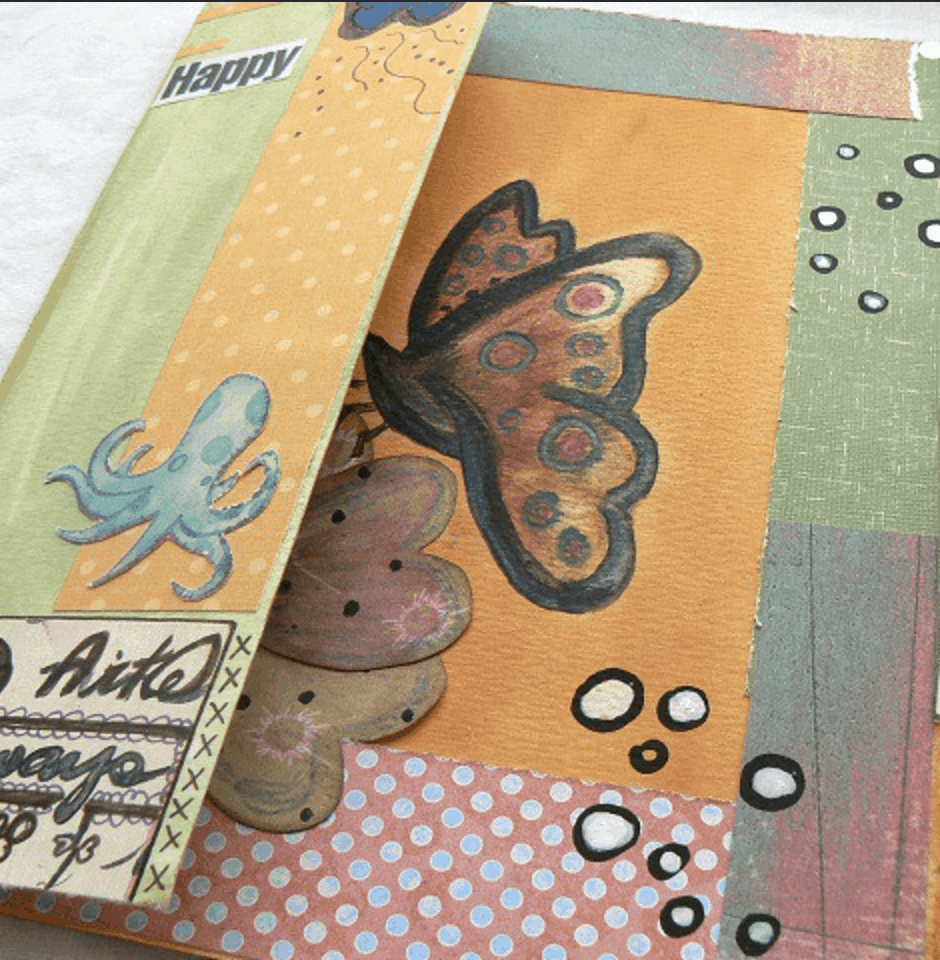 butterfly and octopus on painted creative journal pages