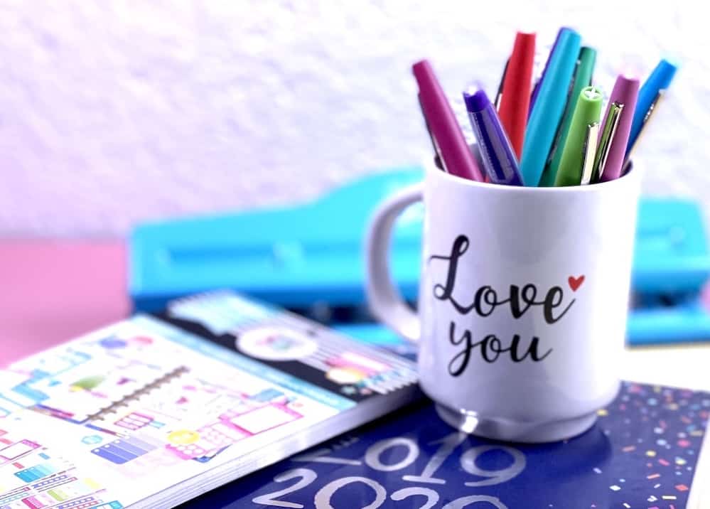 flair pens in an i love you cup with planners