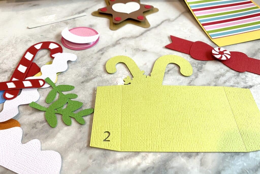 cut cardstock papers for gingerbread box card